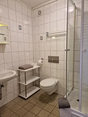 Ein Badezimmer in der Unterkunft Pension Moers am Geleucht