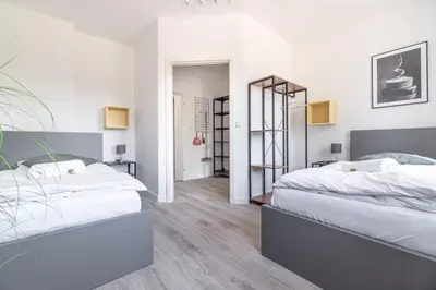 Ein Bett oder Betten in einem Zimmer der Unterkunft Workers Home W136 l 2 Schlafzimmer für 4 Personen