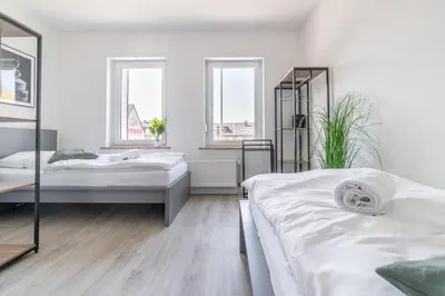 Ein Bett oder Betten in einem Zimmer der Unterkunft Workers Home W136 l 2 Schlafzimmer für 4 Personen