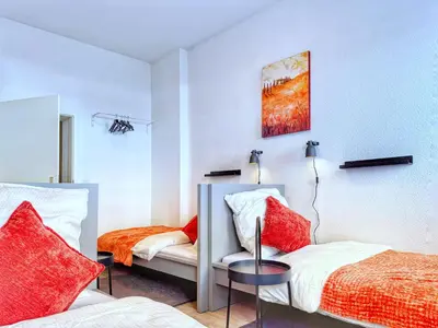 Ein Bett oder Betten in einem Zimmer der Unterkunft Ring-Apartments Kompakt - Gelsenkirchen Zentrum
