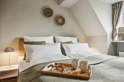Ein Bett oder Betten in einem Zimmer der Unterkunft Deluxe! 15min Messe & Uniklinik, Arbeitsplatz, Boxspring