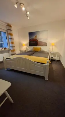 Ein Bett oder Betten in einem Zimmer der Unterkunft Cozy basement apartment in Mettmann
