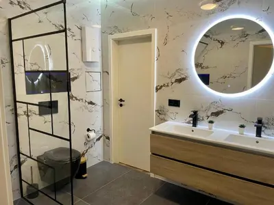 Ein Badezimmer in der Unterkunft Aura Apartament Oberhausen