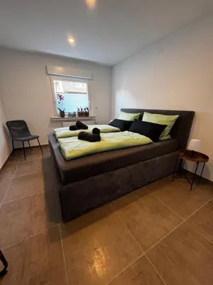 Ein Bett oder Betten in einem Zimmer der Unterkunft Quartier 4 - modern und mit bester Verkehrsanbindung