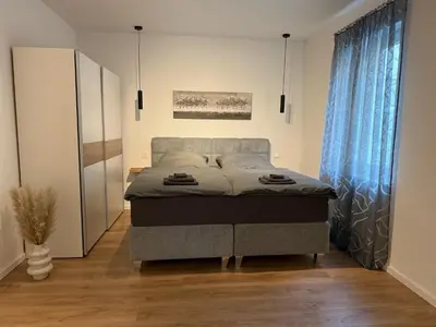 Ein Bett oder Betten in einem Zimmer der Unterkunft Wohnung Schwerte