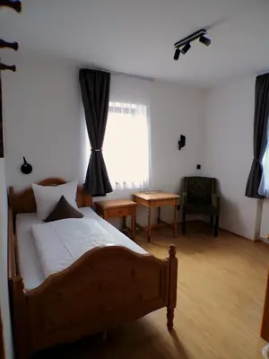 Ein Bett oder Betten in einem Zimmer der Unterkunft Landhaus Sassenhof