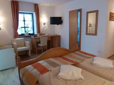 Ein Bett oder Betten in einem Zimmer der Unterkunft Landhaus Sassenhof
