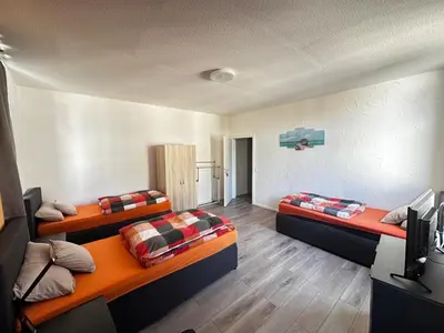Ein Bett oder Betten in einem Zimmer der Unterkunft Lavalya Zimmervermittlung Wuppertal