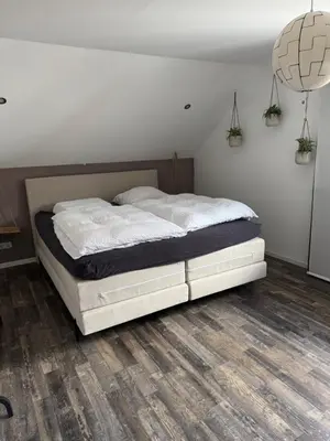 Ein Bett oder Betten in einem Zimmer der Unterkunft Licata Trade fair accommodation - Messezimmer