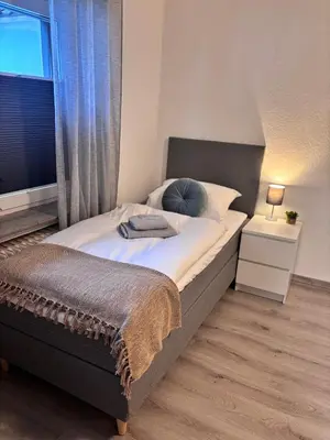 Ein Bett oder Betten in einem Zimmer der Unterkunft Apartment-Topnik Datteln