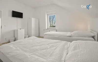 Ein Bett oder Betten in einem Zimmer der Unterkunft BEGE APARTMENTS WorkFlow