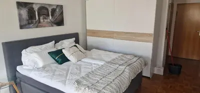 Ein Bett oder Betten in einem Zimmer der Unterkunft Cozy & Fully Equipped Flat in a Prime Location