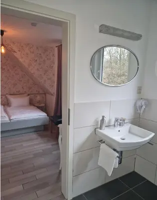 Ein Bett oder Betten in einem Zimmer der Unterkunft Hotel Haus Niggemann