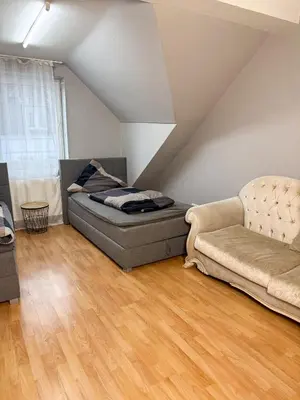 Ein Sitzbereich in der Unterkunft Ruhr Business Apartments Essen Apartment mit 7 Einzelbetten