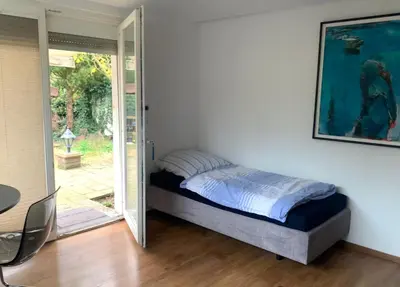 Ein Bett oder Betten in einem Zimmer der Unterkunft Messe Premium Apartment