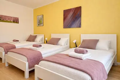 Ein Bett oder Betten in einem Zimmer der Unterkunft VAJAGIC 2 - Apartment 5 Pers, 2 Schlafzimmer, Messe, Uni Klinik