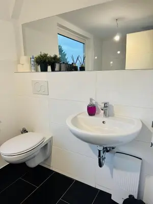 Ein Badezimmer in der Unterkunft Charmante Unterkunft mit 2 Schlafzimmern, Smart-TV, WLAN