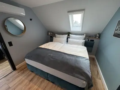 Ein Bett oder Betten in einem Zimmer der Unterkunft Luxury Suite for 8