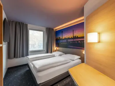 Ein Bett oder Betten in einem Zimmer der Unterkunft B&B Hotel Düsseldorf-City