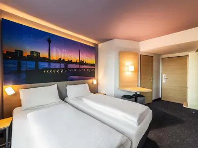 Ein Bett oder Betten in einem Zimmer der Unterkunft B&B Hotel Düsseldorf-City