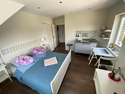 Ein Bett oder Betten in einem Zimmer der Unterkunft Bed and Breakfast Orange-Inn