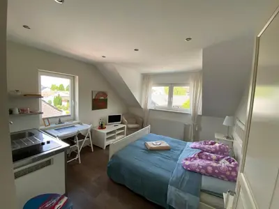 Ein Bett oder Betten in einem Zimmer der Unterkunft Bed and Breakfast Orange-Inn