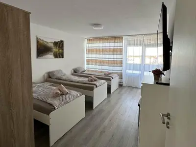 Ein Bett oder Betten in einem Zimmer der Unterkunft Modernes Apartment mit Balkon