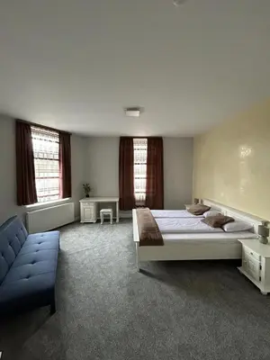 Ein Bett oder Betten in einem Zimmer der Unterkunft Sia Apartments Hotel