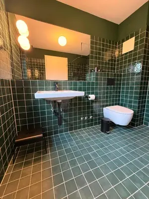 Ein Badezimmer in der Unterkunft Das SILO
