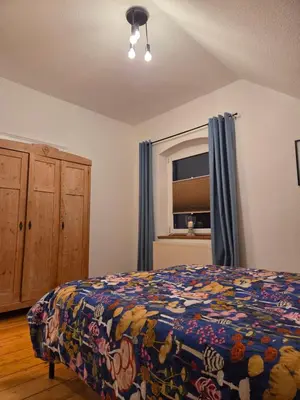 Ein Bett oder Betten in einem Zimmer der Unterkunft Quartier1905 charmanter Altbau waldnah & verkehrsgünstig