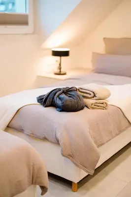 Ein Bett oder Betten in einem Zimmer der Unterkunft saGo Airporthouse