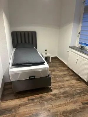 Ein Bett oder Betten in einem Zimmer der Unterkunft Monteurzimmer Auras
