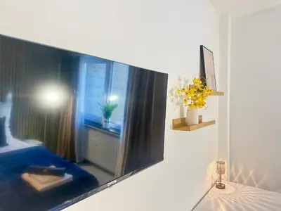 Ein Bett oder Betten in einem Zimmer der Unterkunft Business Apartment City 5 Betten & Parkplatz