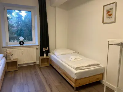Ein Bett oder Betten in einem Zimmer der Unterkunft T&K Apartments - Gelsenkirchen - 2 Schlafzimmer Wohnungen - Vollausgestattet