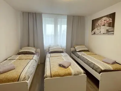 Ein Bett oder Betten in einem Zimmer der Unterkunft Voll ausgestattetes Apartment in Marl
