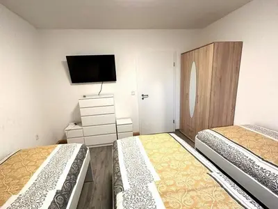 Ein Bett oder Betten in einem Zimmer der Unterkunft Voll ausgestattetes Apartment in Marl