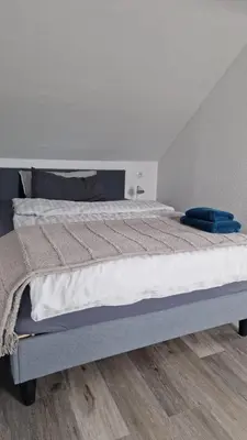 Ein Bett oder Betten in einem Zimmer der Unterkunft MaxMir - Ortlohn Apartment