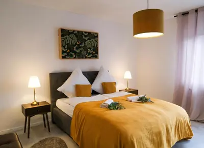 Ein Bett oder Betten in einem Zimmer der Unterkunft Deluxe House mit Terrasse & Garten - Komfort & Raum