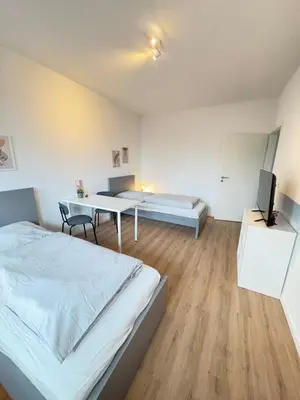 Ein Bett oder Betten in einem Zimmer der Unterkunft Workerslodge - Wohnung für 6 Personen in Ratingen - nähe Düsseldorf