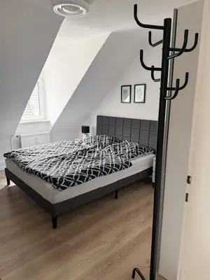 Ein Bett oder Betten in einem Zimmer der Unterkunft Gemütliche Wohnung über den Dächern von Gevelsberg