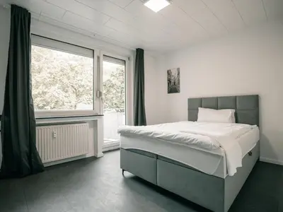 Ein Bett oder Betten in einem Zimmer der Unterkunft Große Unterkunft in Dortmund City