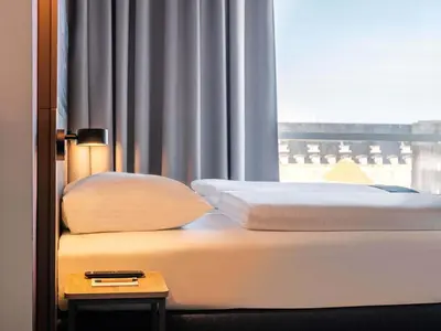 Ein Bett oder Betten in einem Zimmer der Unterkunft B&B Hotel Duisburg Hbf-Süd