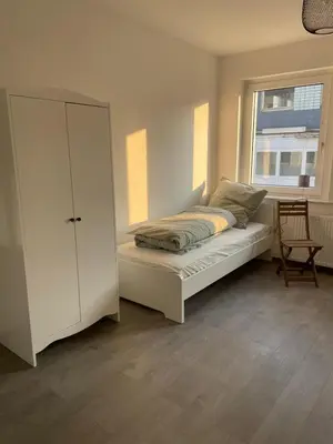 Ein Bett oder Betten in einem Zimmer der Unterkunft Einzelzimmer im Monteurhaus Gemeinschaftsbad und Küche