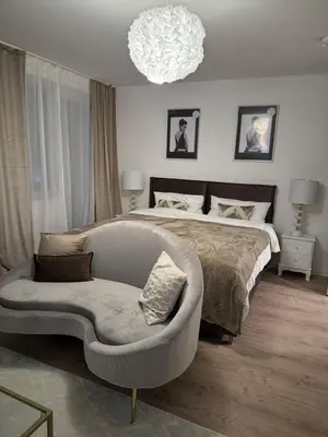 Ein Bett oder Betten in einem Zimmer der Unterkunft Cozy City Apartment