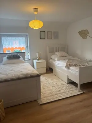 Ein Bett oder Betten in einem Zimmer der Unterkunft 115 qm Apartment für bis zu 8 Personen mit 4 Schlafzimmern