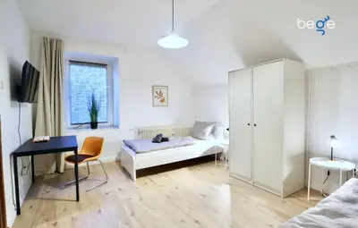 Ein Bett oder Betten in einem Zimmer der Unterkunft BEGE APARTMENTS DeskSide