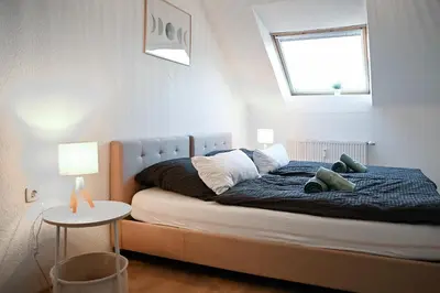 Ein Bett oder Betten in einem Zimmer der Unterkunft JuPa Homes gemütliches DG Apartment