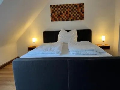 Ein Bett oder Betten in einem Zimmer der Unterkunft Dachgeschosswohnung im 3-Städteeck