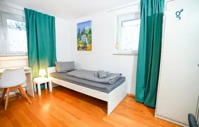 Ein Bett oder Betten in einem Zimmer der Unterkunft BEGE APARTMENTS TeamHome