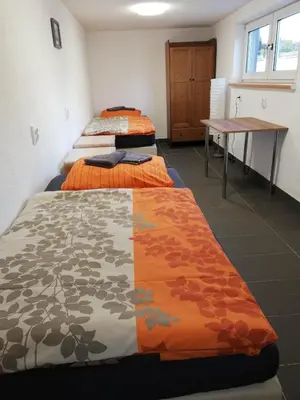Ein Bett oder Betten in einem Zimmer der Unterkunft Pension Moers am Geleucht Fewo 1